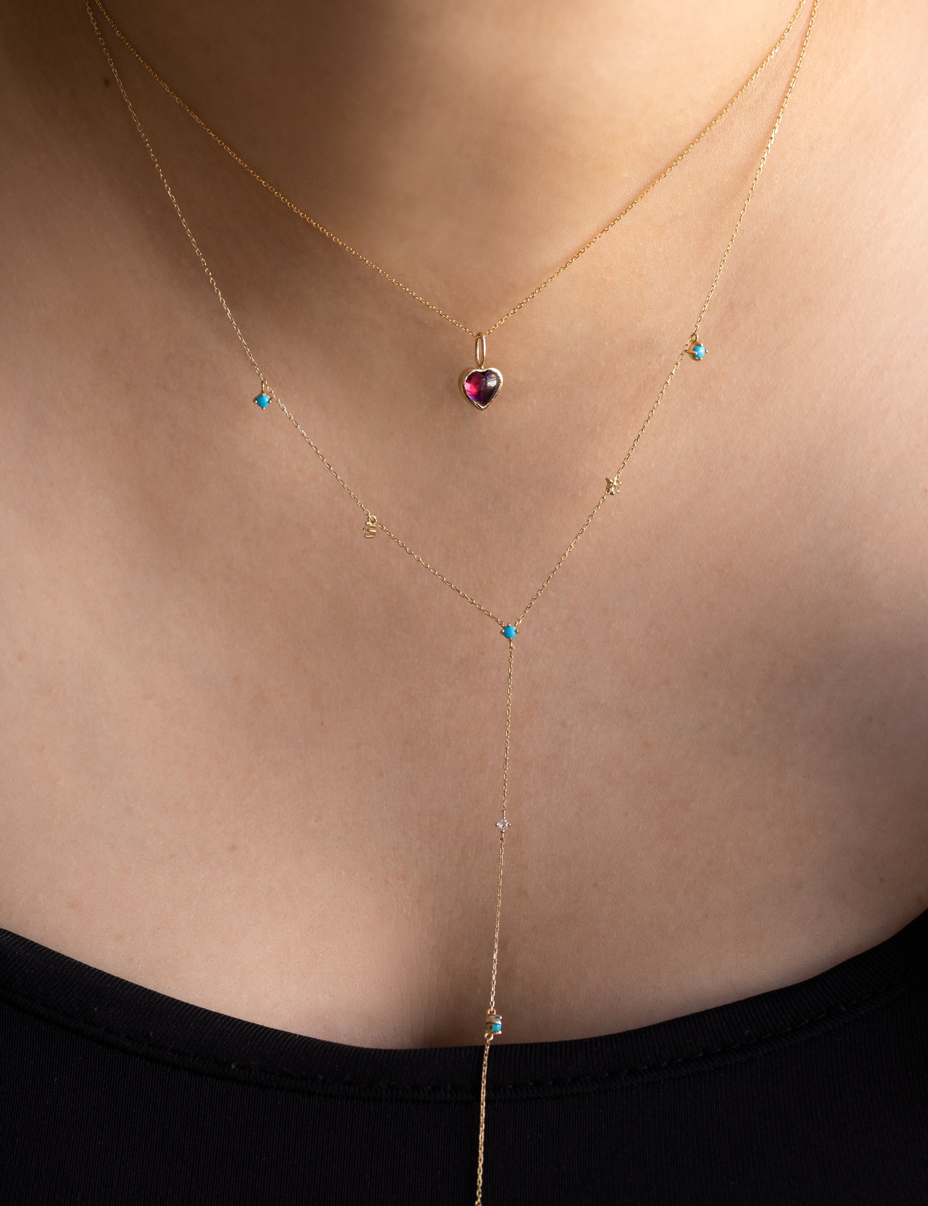 XO Rhodolite Garnet Charm